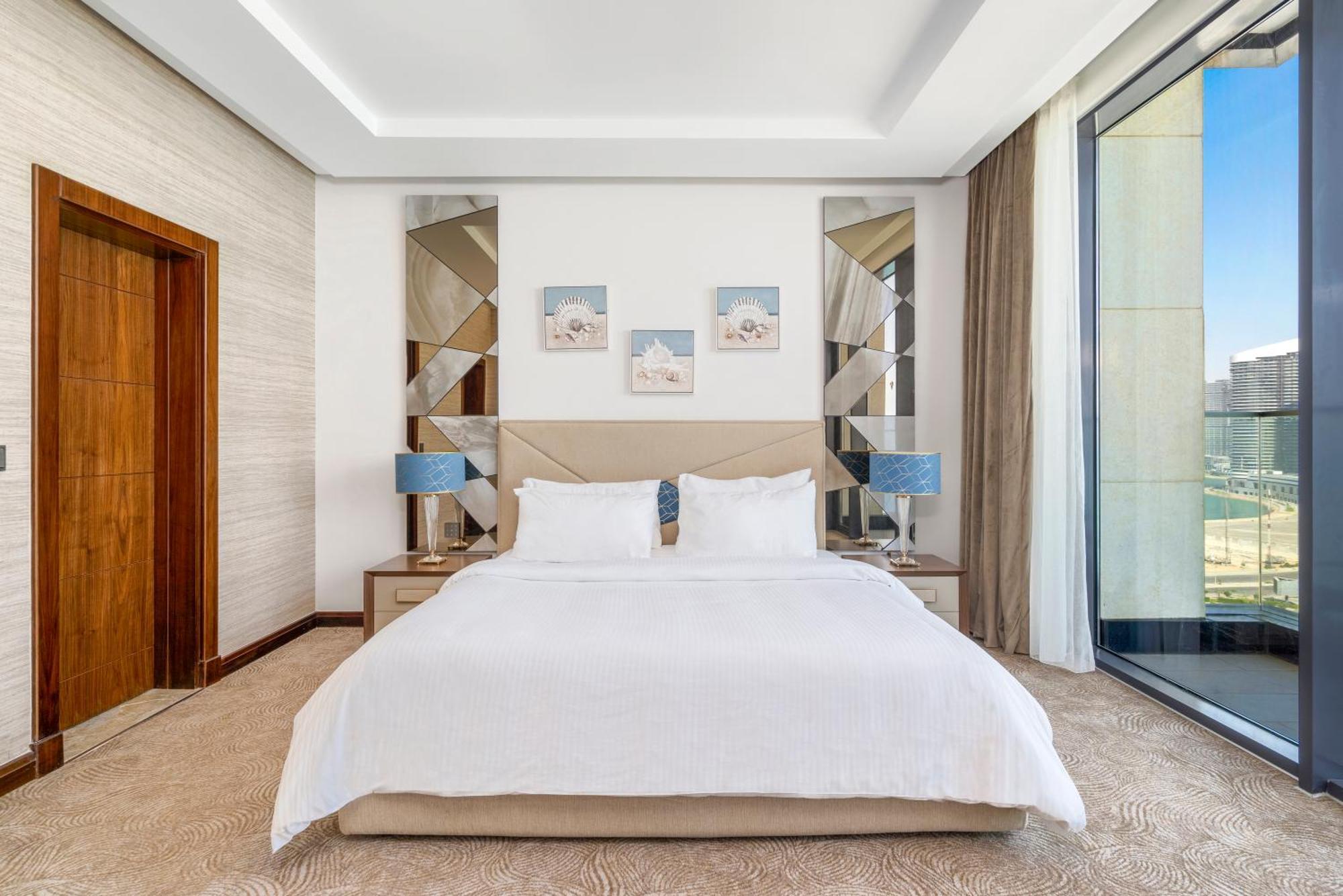 Rixos Premium Alamein El Alamein Kamer foto A bedroom at the hotel